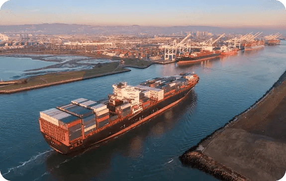 Large container ship leaving harbor with access to remote diagnostic devices and telehealth for maritime emergency care.